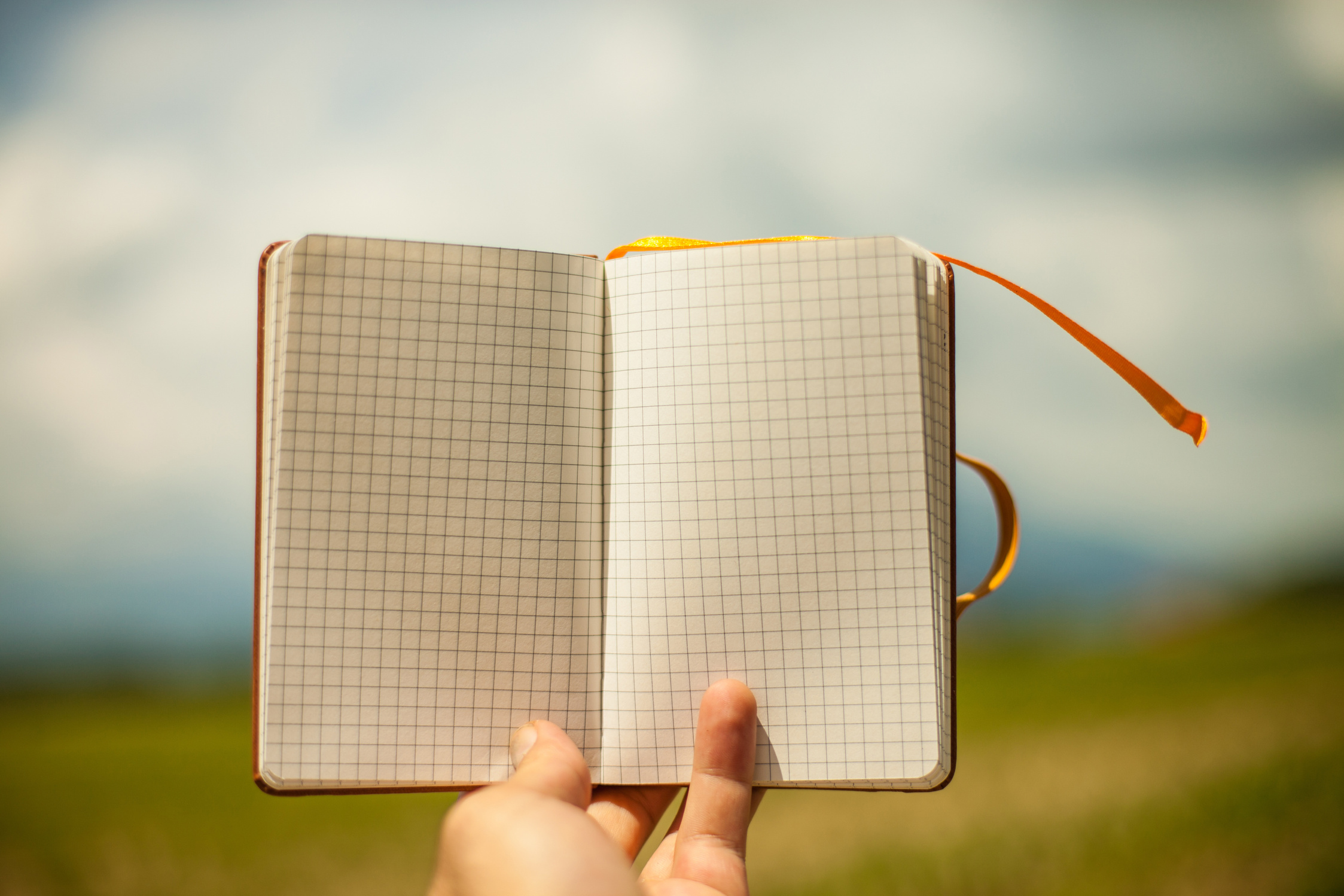 Hand Holding Notepad